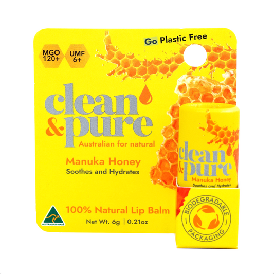 Clean & Pure Manuka Honey lip balm packaging on a white background